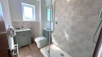 Shower, hair dryer, towels