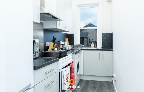 Microwave, oven, cookware/dishes/utensils, dining tables
