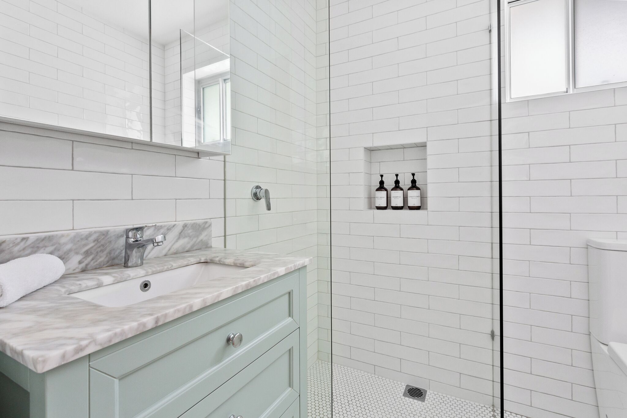 Shower, hair dryer, towels, soap