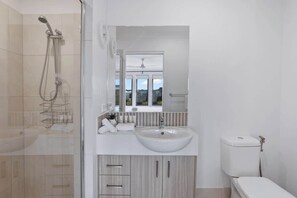 Shower, hair dryer, towels, shampoo