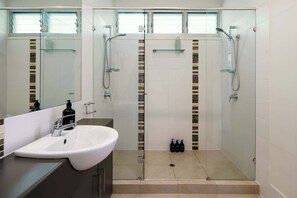 Shower, hair dryer, towels, shampoo