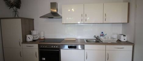 Fridge, oven, stovetop, dining tables