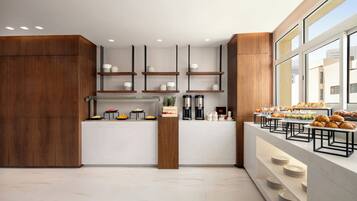 A modern kitchen with wooden accents, built-in shelves, and a breakfast bar with pastries.