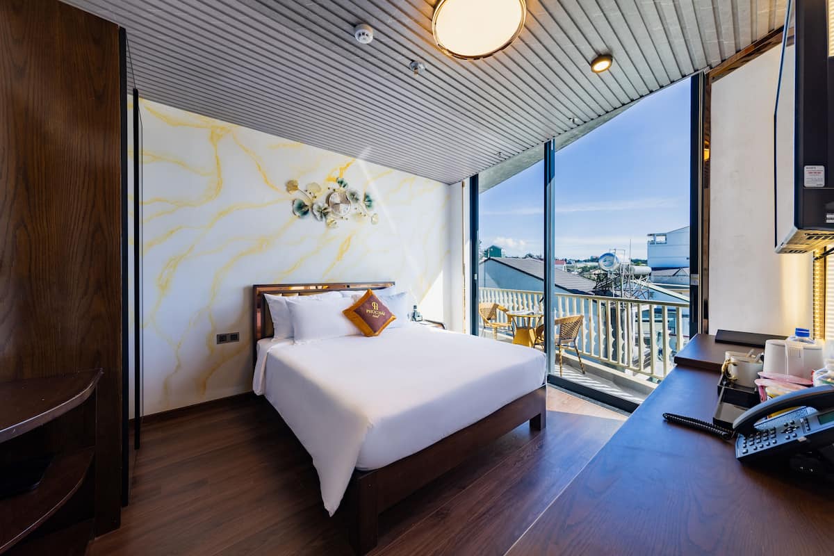 Standaard tweepersoonskamer, balkon | 2 slaapkamers, luxe beddengoed, een minibar met enkele gratis items
