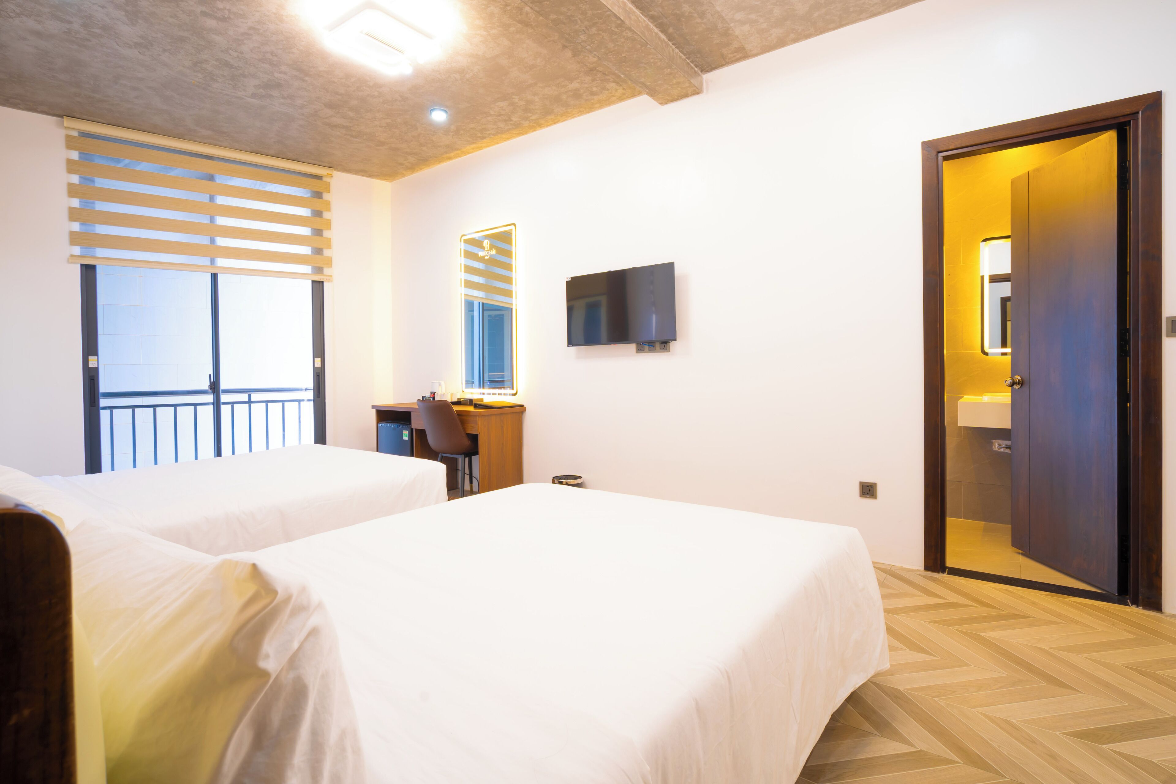 Luxe beddengoed, een minibar met enkele gratis items