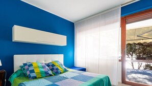 A bedroom with a bed, a window, and a view of the outside. - il nido sul Mare by Interhome (Cervo)