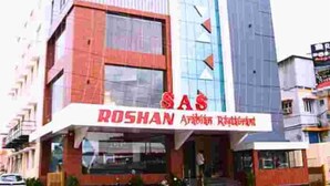 A multi-story building with a prominent 'SAS' sign and 'Roshon Arabian Restaurant' signage. - SAS SQUARE (Tiruchirappalli)