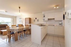 Microwave, stovetop, coffee/tea maker, dining tables