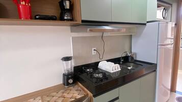 Estúdio conforto | Área de estar | TV