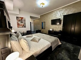 Deluxe Double Room | Minibar, desk, laptop workspace, blackout drapes