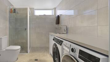 Shower, hair dryer, towels, soap