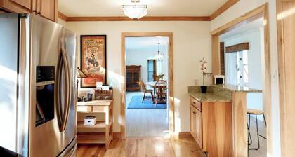 Spacious Sunny Home with a Big Fenced Yard near Downtown, near walking paths, bridge over creek, park, pool, playground and YMCA all within walking distance.