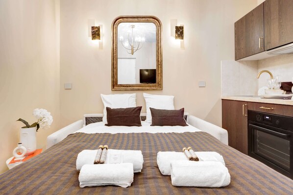 1 bedroom, desk, iron/ironing board, travel crib