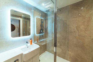 Shower, hair dryer, towels, soap