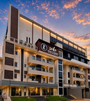 A multi-story hotel with a prominent sign reading 'Hotel Hillside.' - Hillside Hotel (Mysore)