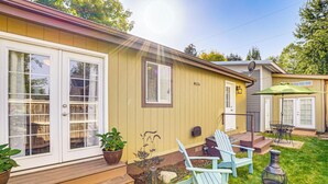A house with a deck, outdoor seating, and a fire pit. - 1 Mi to Tubbs Hill & Lake: Midtown Home w/ Yard! (Coeur d'Alene)
