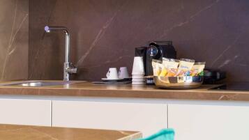 Coffee/tea maker, fridge, microwave, oven