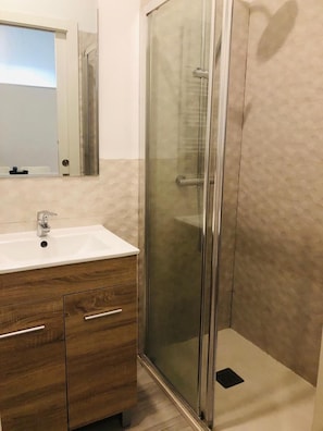 Shower, hair dryer, towels, soap