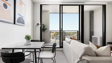 One Bedroom Apartment with Parking | Living area | Flat-screen TV