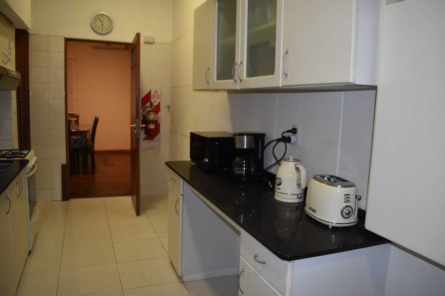 Full-sized fridge, microwave, stovetop, coffee/tea maker
