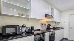 Fridge, microwave, stovetop, coffee/tea maker