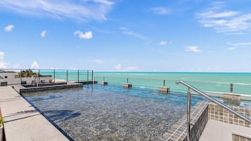 Outdoor pool, open 6:00 AM to 10:00 PM, pool umbrellas, pool loungers