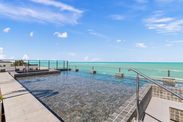 Outdoor pool, open 6:00 AM to 10:00 PM, pool umbrellas, sun loungers