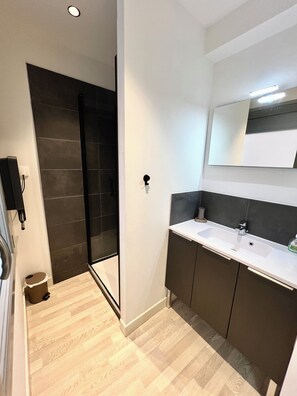 Shower, hair dryer, towels, soap