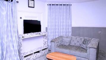 Habitación | Área de sala de estar | Televisión de pantalla plana
