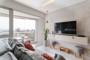 Loft 305 | Área de estar | TV de tela plana