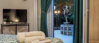 Relaxation villa surrounded by greenery with outdoor pool, sauna and whirlpool.