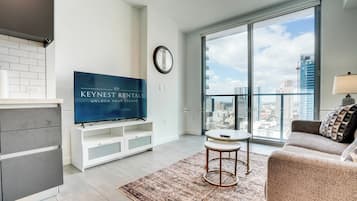Deluxe Condo, City View | Living area | 55-inch Smart TV with digital channels, Netflix, streaming services