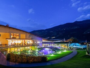 A hotel with a pool area, outdoor seating, and a mountain backdrop. - Chalet in Fugen Near Spieljoch Ski Lift (Fuegen)