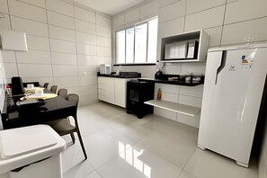 Fridge, microwave, dining tables
