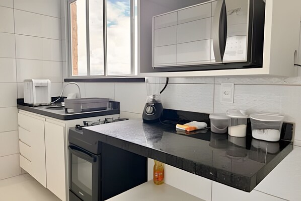 Panoramic Suite | Private kitchen | Fridge, microwave, dining tables