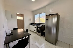 Comfort Apartment | Private kitchen | Shared fridge, microwave, cookware/dishes/utensils - Ghram Hill - By Be Happy (Fortaleza)