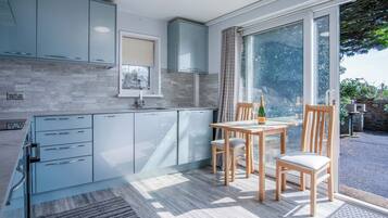 Standard Apartment | Private kitchen | Fridge, microwave, oven, stovetop