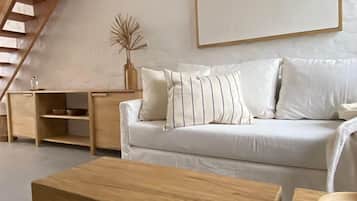 Deluxe Duplex | Living area | Flat-screen TV