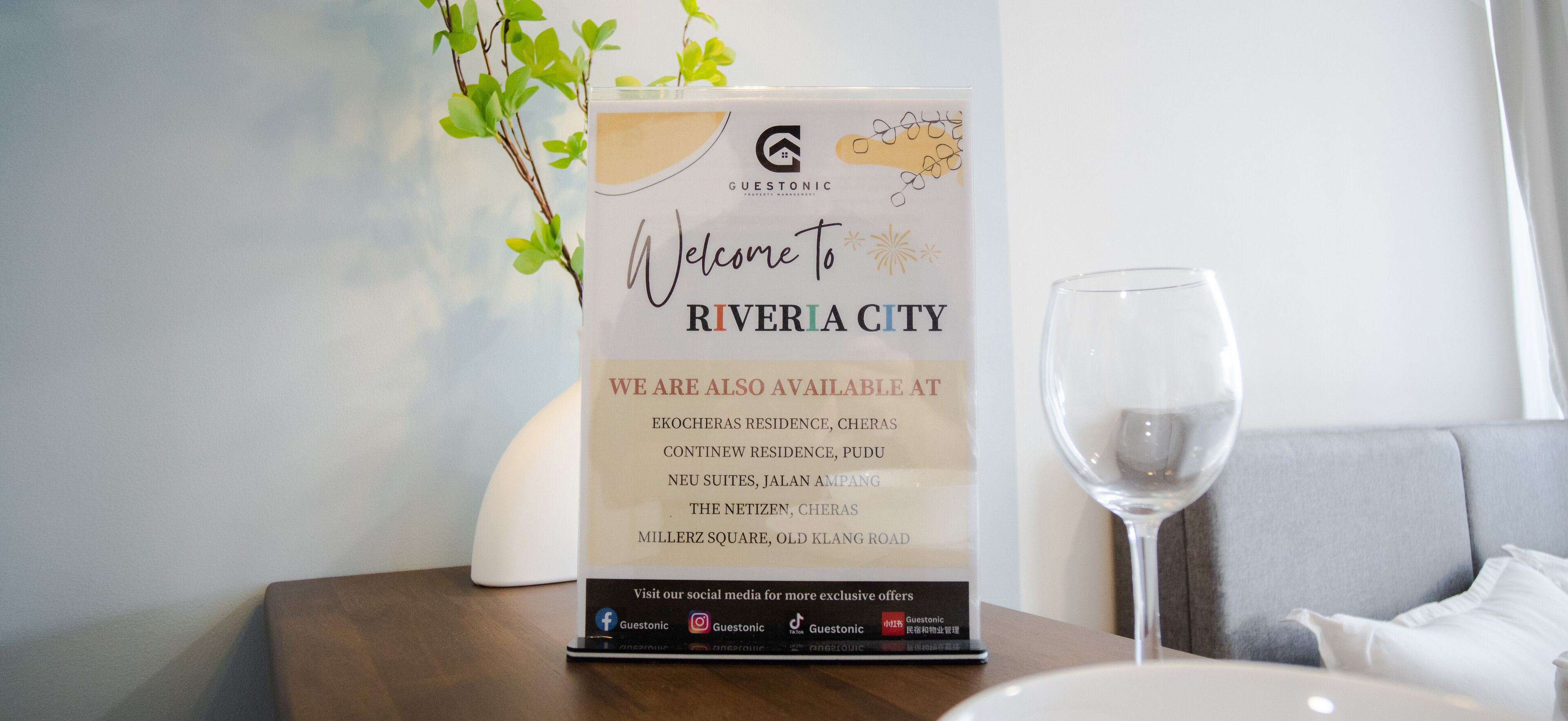 A welcome sign for Riveria City hotel with a list of available locations.