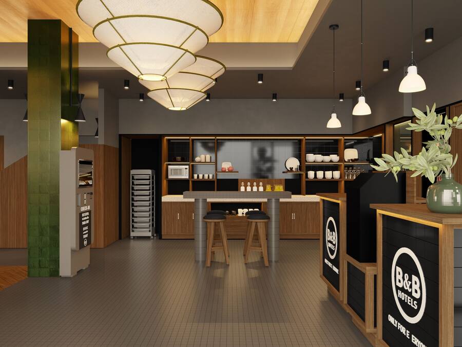 Een moderne keuken met een centraal eiland, houten kastjes en een B&B hotelschild.