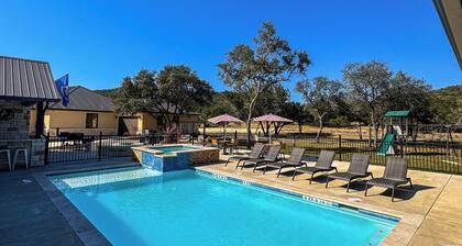 NOLA styled 6-bedroom home in Concan. Sleeps 36 with AC, WiFi, Pool, Hot Tub