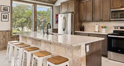 NOLA styled 6-bedroom home in Concan. Sleeps 36 with AC, WiFi, Pool, Hot Tub