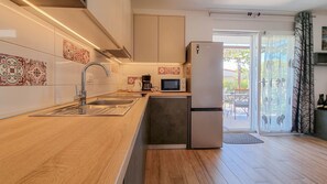 Fridge, microwave, stovetop, coffee/tea maker