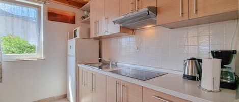 Fridge, microwave, stovetop, coffee/tea maker