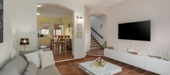 Mediterranean holiday home with sun loungers, parasol, private garden, barbecue, air-conditioned bedrooms