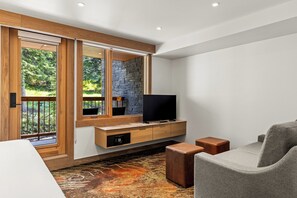 Superior King Suite | Living area | 50-inch TV with cable channels - Otter Hotel (Banff)