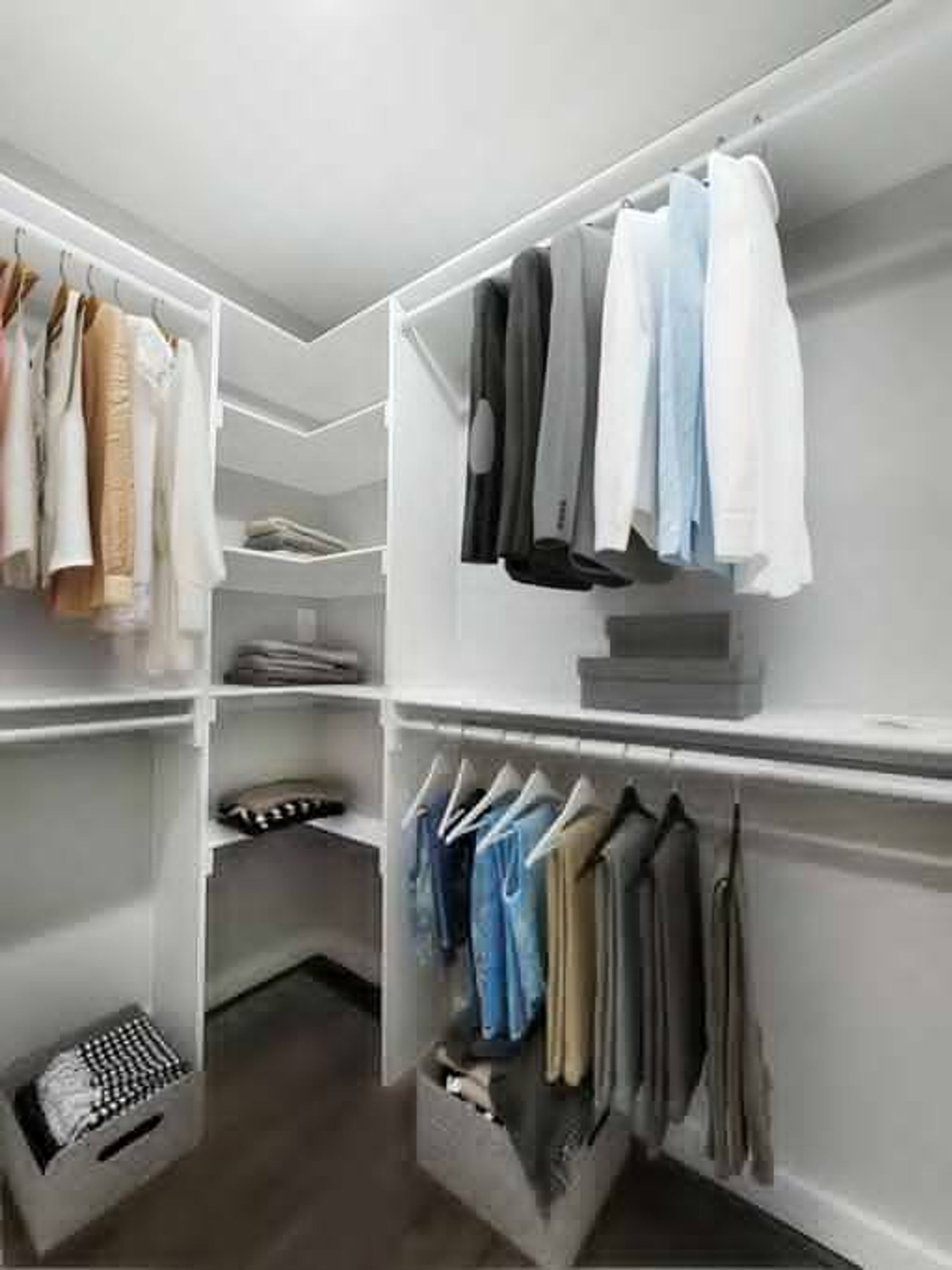 A walk-in closet with multiple shelves and hanging spaces for clothes.