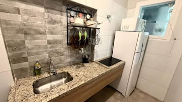 Apartment | Private kitchen | Microwave, stovetop, cookware/dishes/utensils
