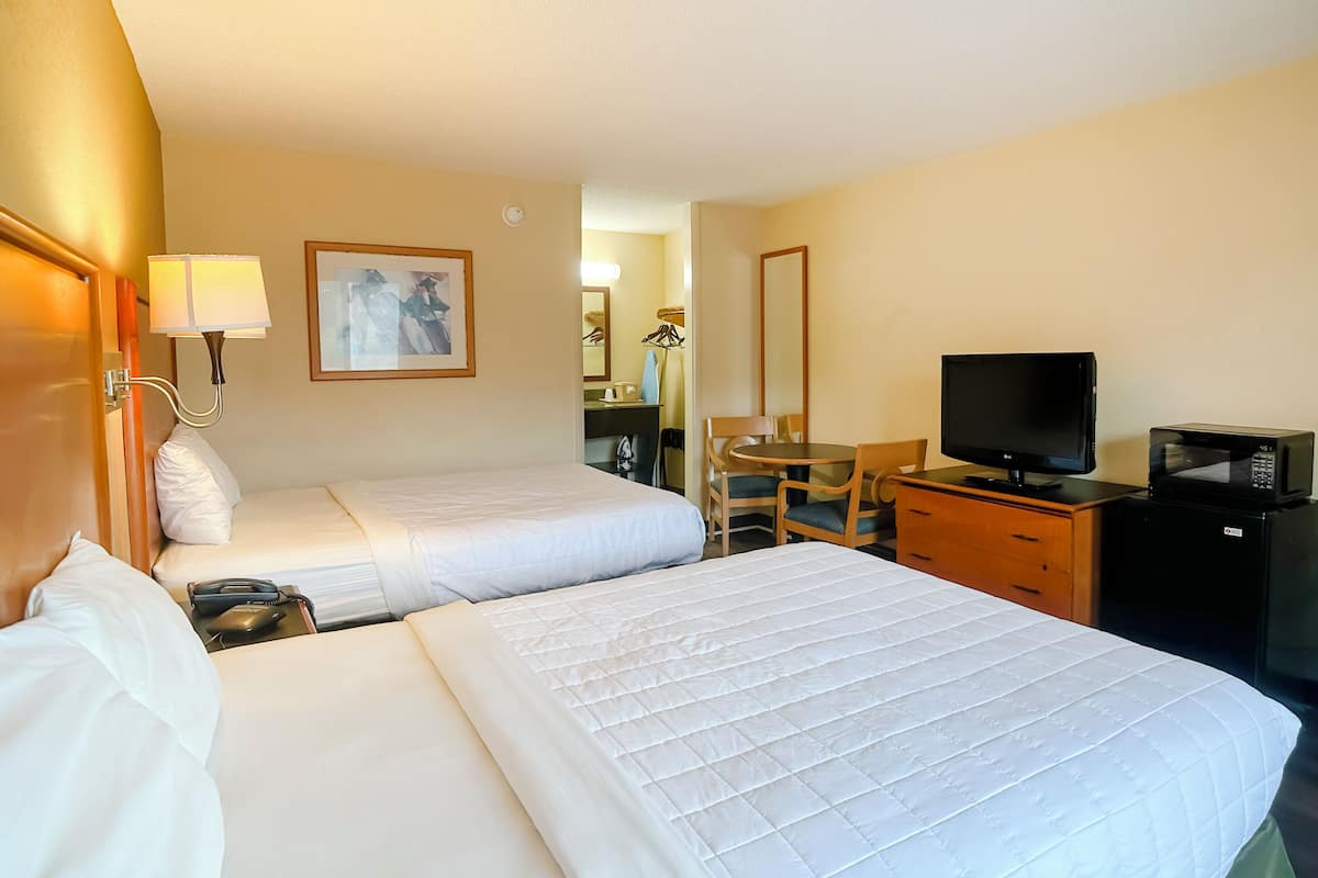Room, 2 Queen Beds, Smoking | 1 bedroom, desk, iron/ironing board, free WiFi