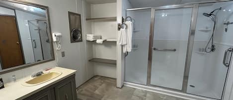 Shower, hair dryer, towels, soap